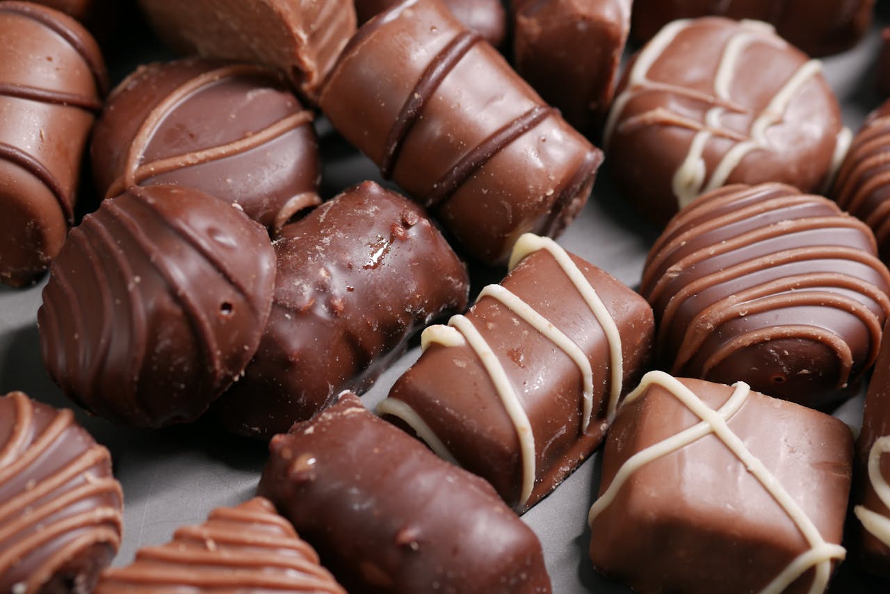 Close-up of delicious assorted gourmet chocolates beautifully arranged.